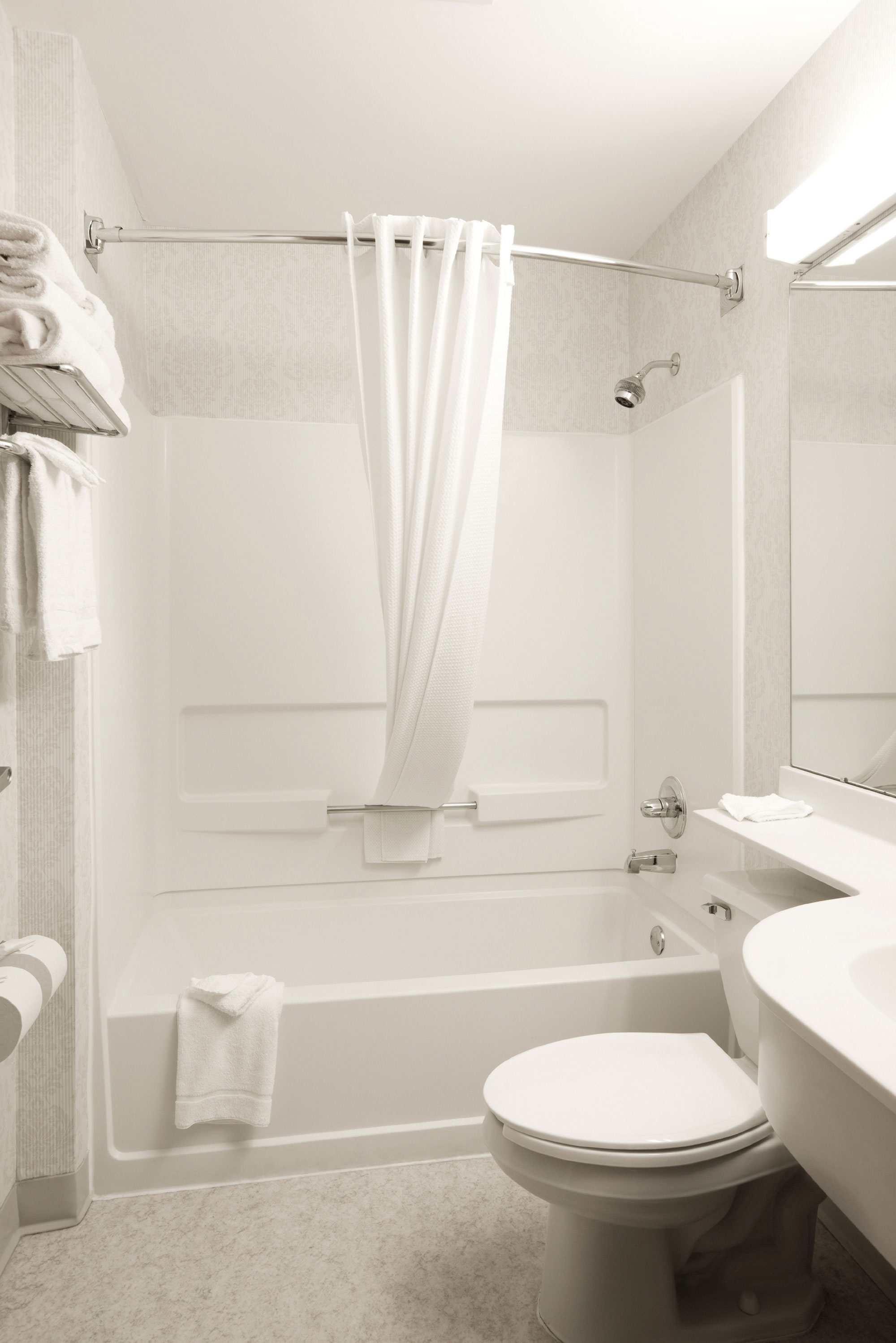 white bathroom with bath and shower 
